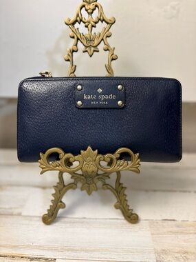 kate spade navy pebble leather zip-around wallet with gold logo